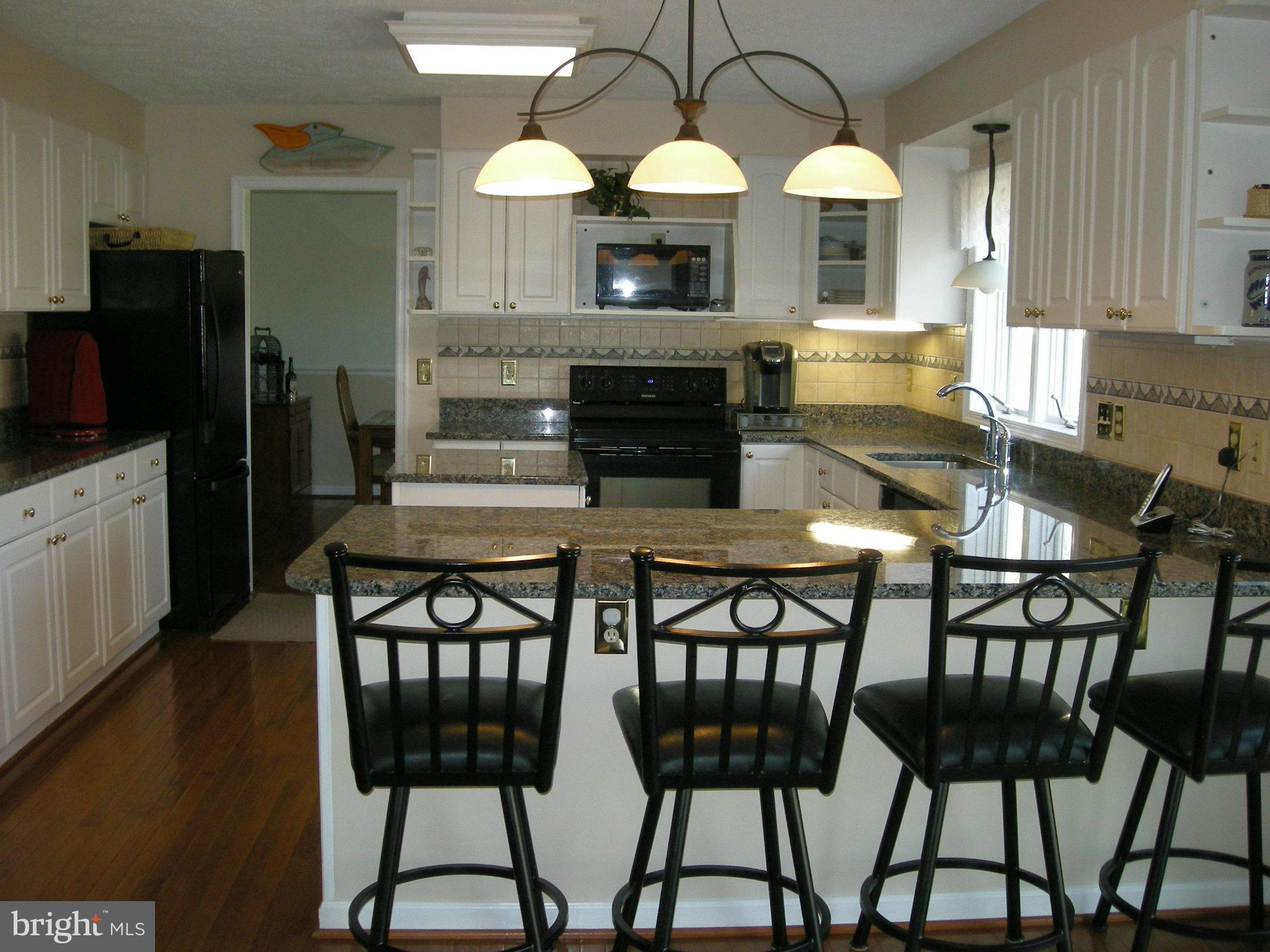 11911 Bluestone Road Kingsville, MD 21087 - Photo 8 of 30 Kitchen features a breakfast bar