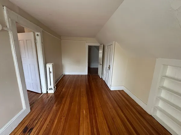 a view of wooden floor in an empty room