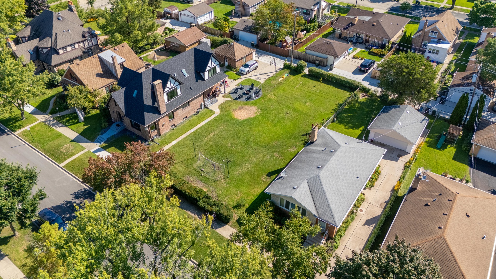 8041 North Merrill Street Niles, IL 60714 - Photo 6 of 10 an aerial view of residential houses with outdoor space