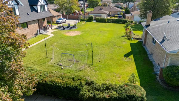a view of an swimming pool with a yard