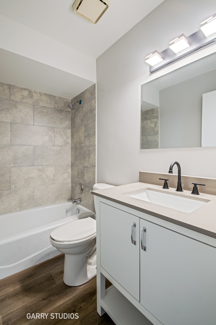 720 Briar Hill Lane, Unit 5 Addison, IL 60101 - Photo 11 of 14 a bathroom with a sink toilet and shower
