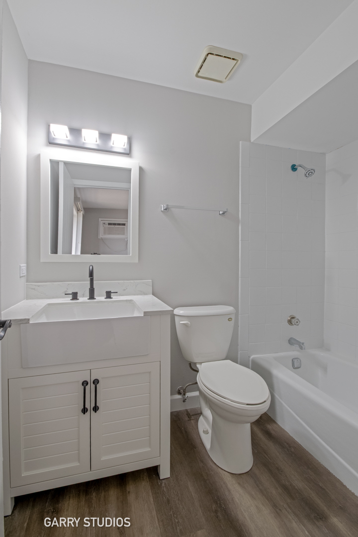 720 Briar Hill Lane, Unit 5 Addison, IL 60101 - Photo 8 of 14 a bathroom with a toilet sink and mirror