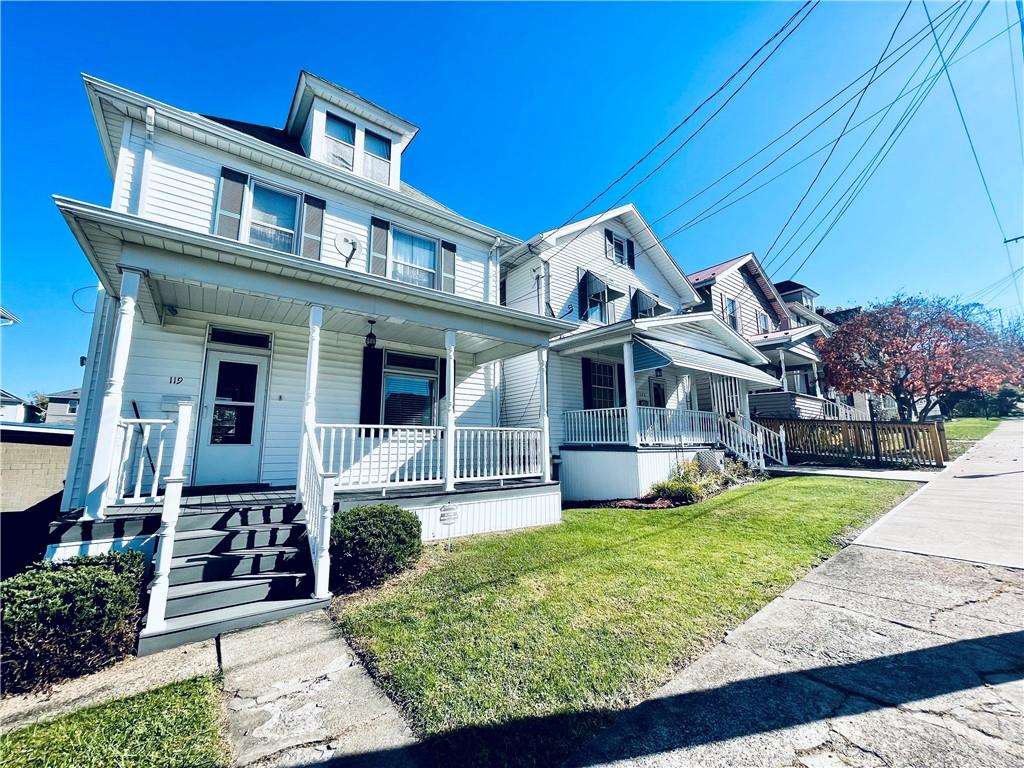 119 East Coffee Street Uniontown, PA 15401 - Photo 1 of 25 a front view of a house with garden
