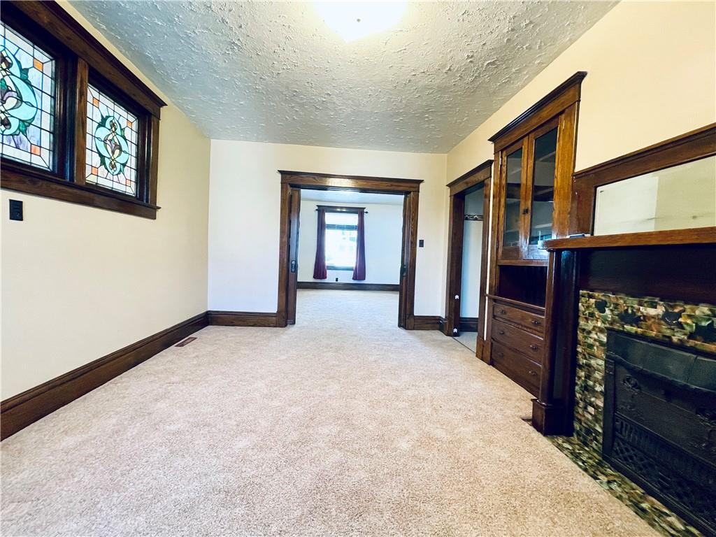 119 East Coffee Street Uniontown, PA 15401 - Photo 11 of 25 a view of an empty room with window and fireplace