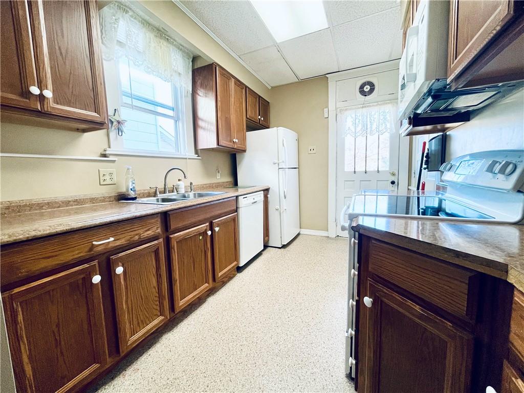 119 East Coffee Street Uniontown, PA 15401 - Photo 12 of 25 a kitchen with stainless steel appliances granite countertop a sink stove and cabinets