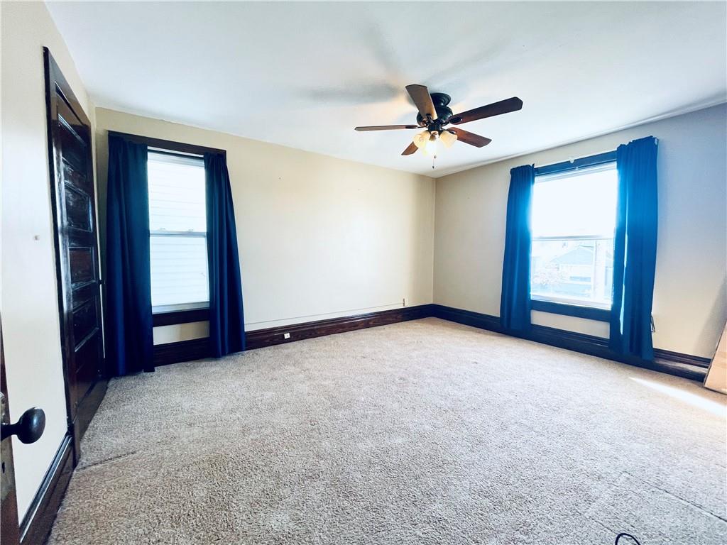 119 East Coffee Street Uniontown, PA 15401 - Photo 17 of 25 an empty room with windows and fan