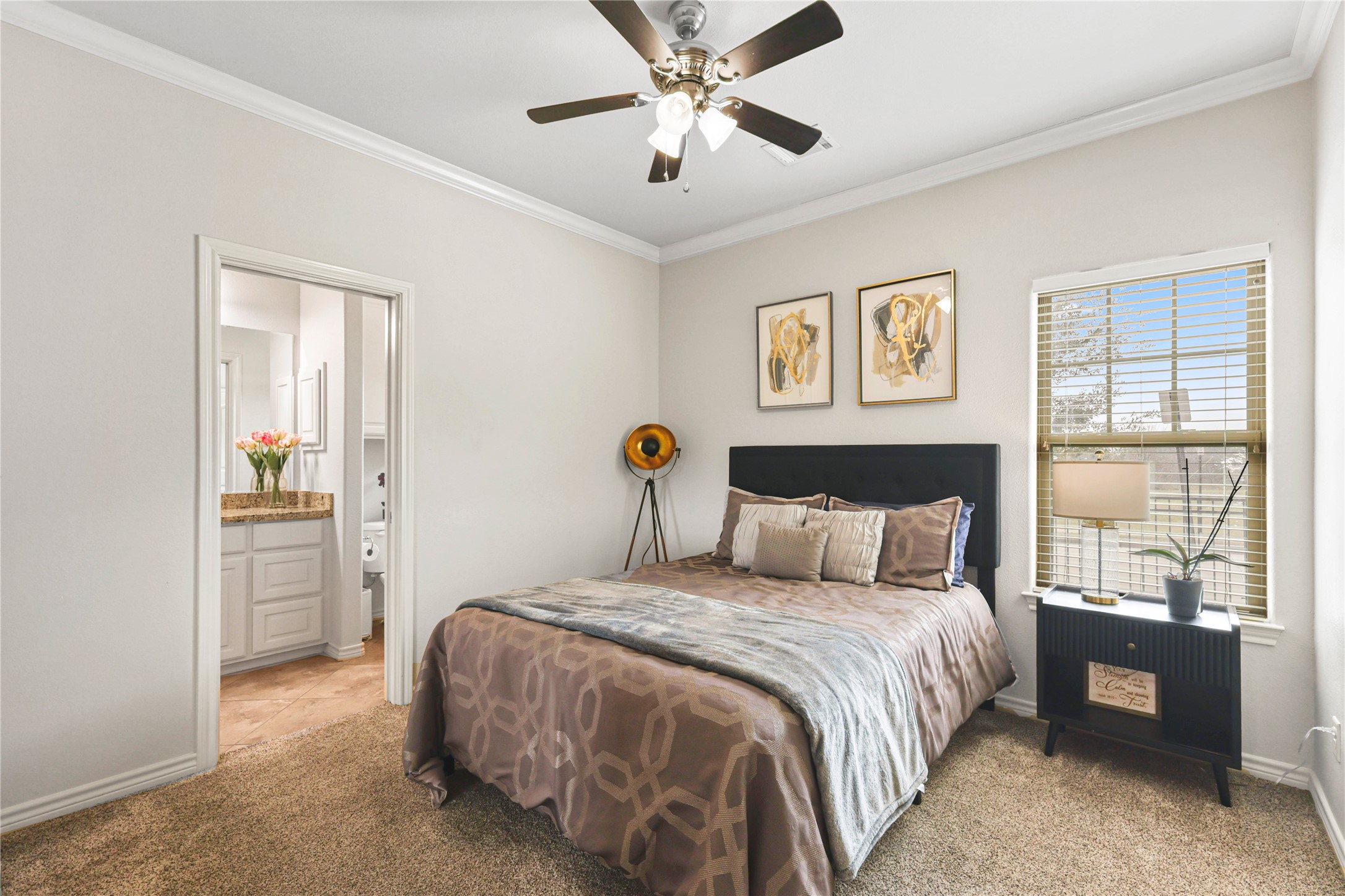 3801 Harvey Road College Station, TX 77845 - Photo 15 of 29 a bedroom with a bed and a chandelier