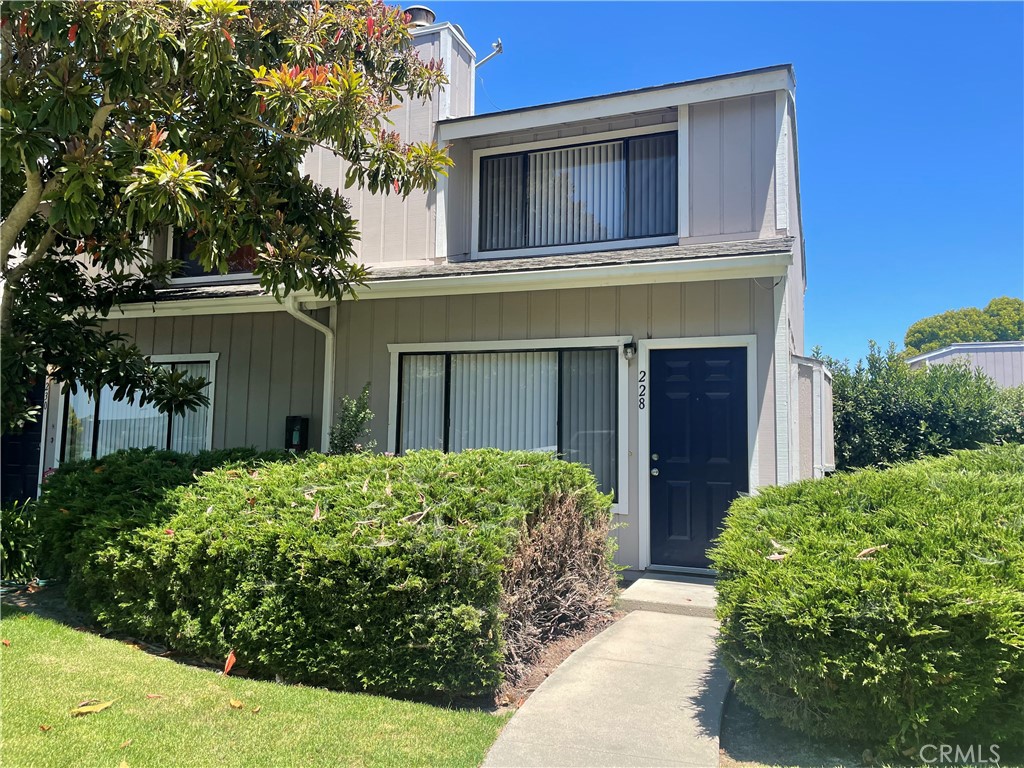 228 North R Street Lompoc, CA 93436 - Photo 1 of 1 a front view of a house with garden