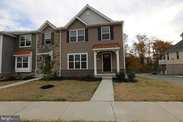 a front view of a house with yard