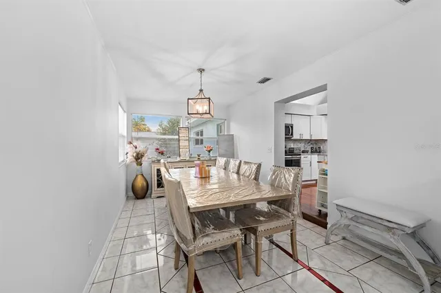 a view of a workspace with furniture and a potted plant