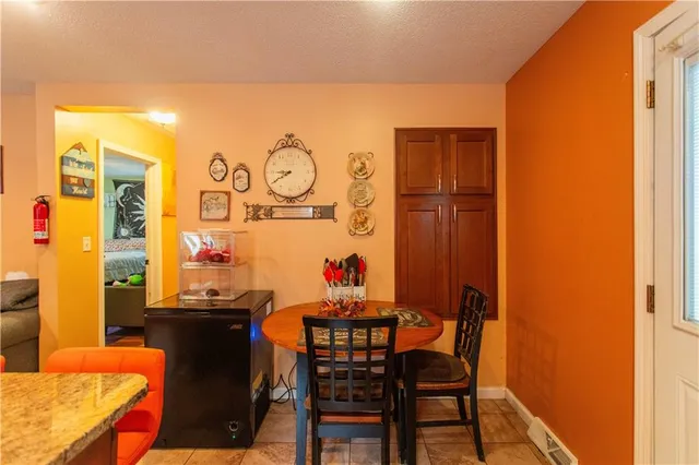 a view of a dining room with furniture and window