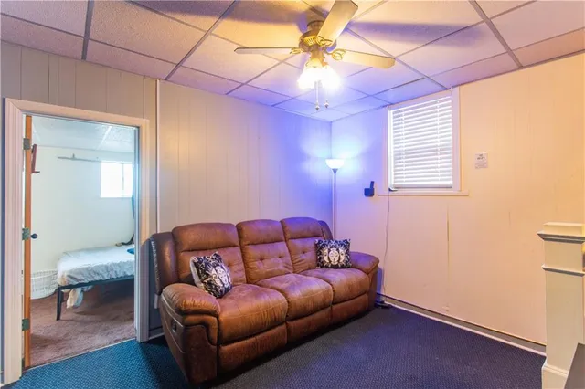 a bedroom with furniture and wooden floor