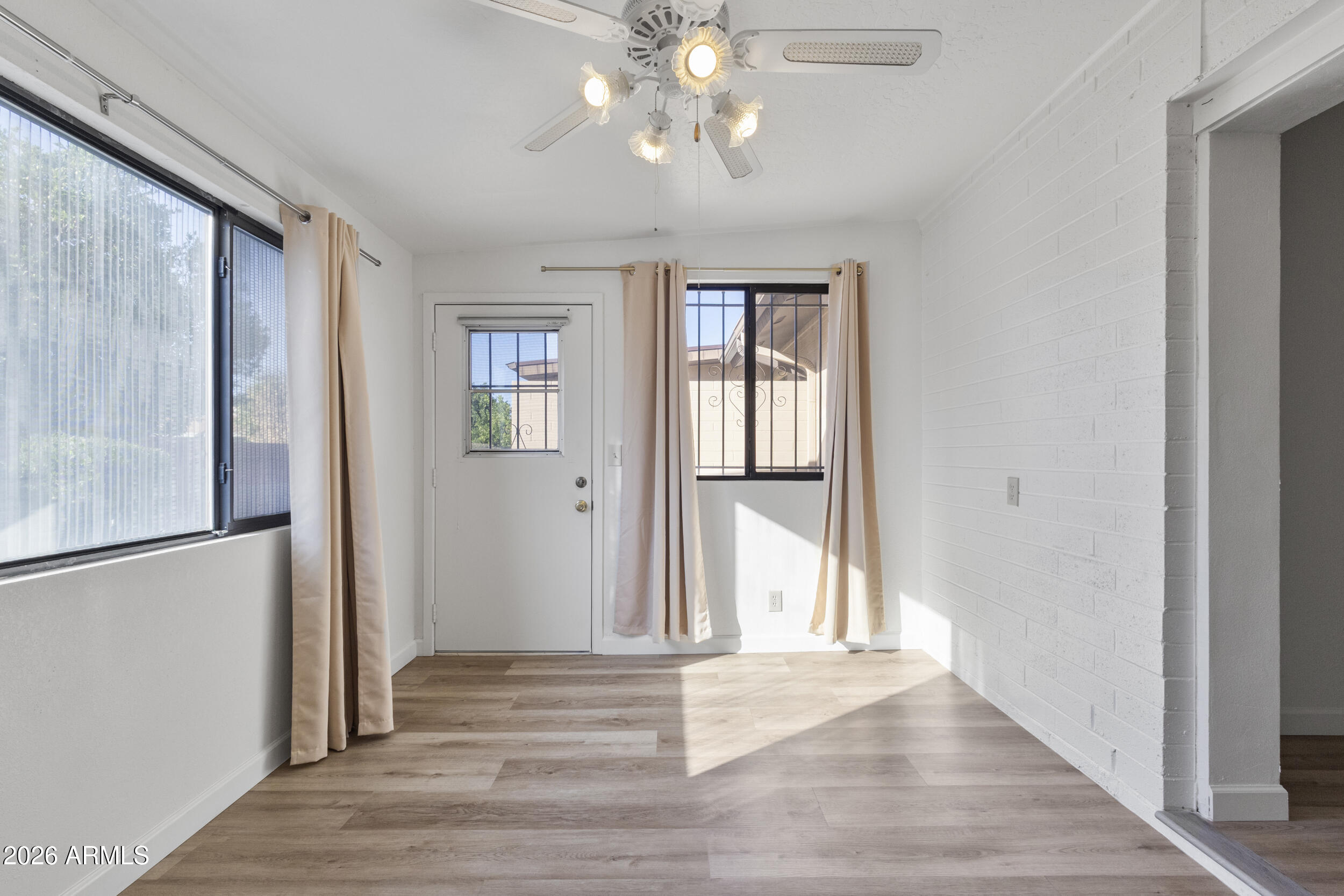 520 South Greenfield Road, Unit 39 Mesa, AZ 85206 - Photo 15 of 27 wooden floor in an empty room with a window