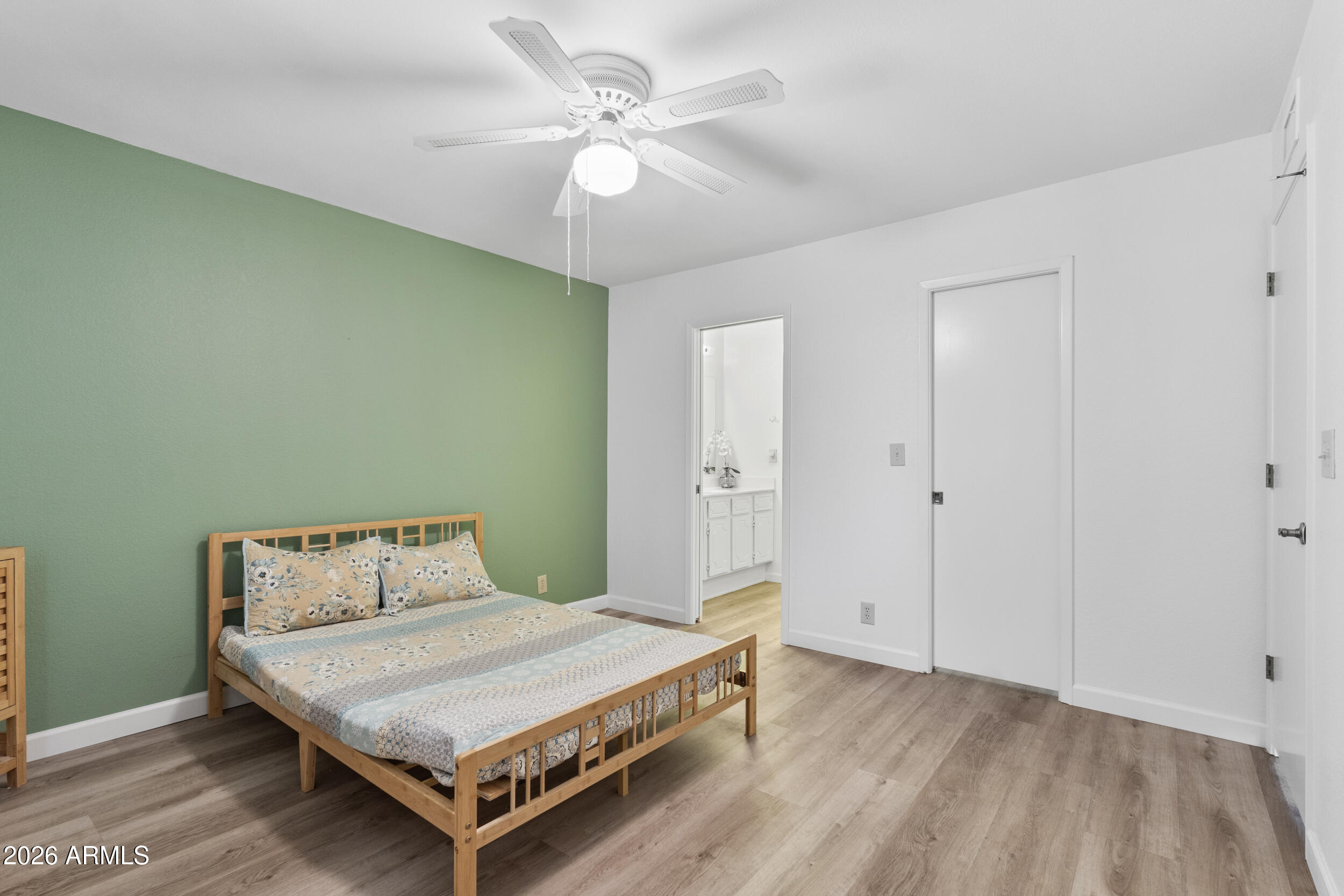 520 South Greenfield Road, Unit 39 Mesa, AZ 85206 - Photo 17 of 27 a bedroom with a bed and a chandelier