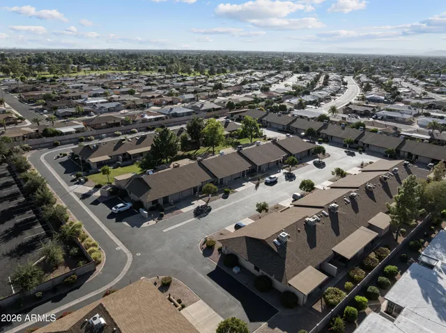 an aerial view of a building with parking space