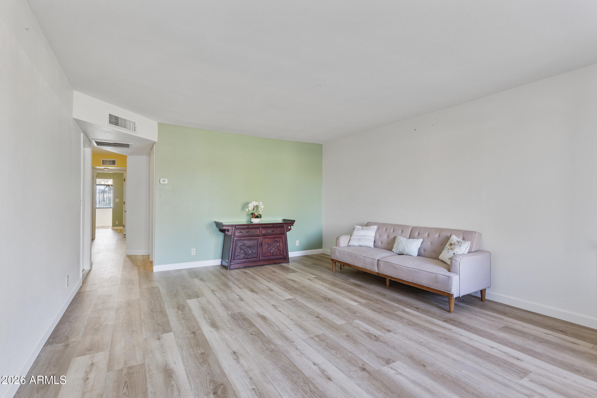 520 South Greenfield Road, Unit 39 Mesa, AZ 85206 - Photo 7 of 27 a living room with furniture and wooden floor