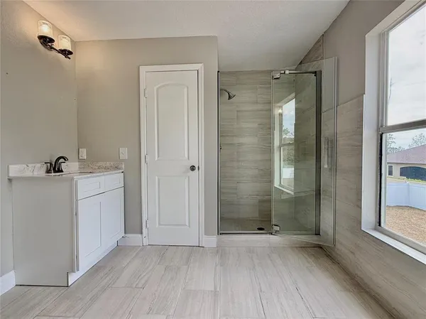 a bathroom with a bathtub and shower
