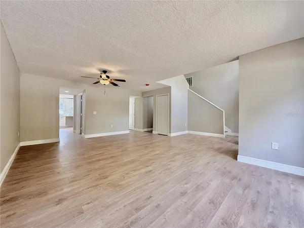 wooden floor in an empty room with a gallery