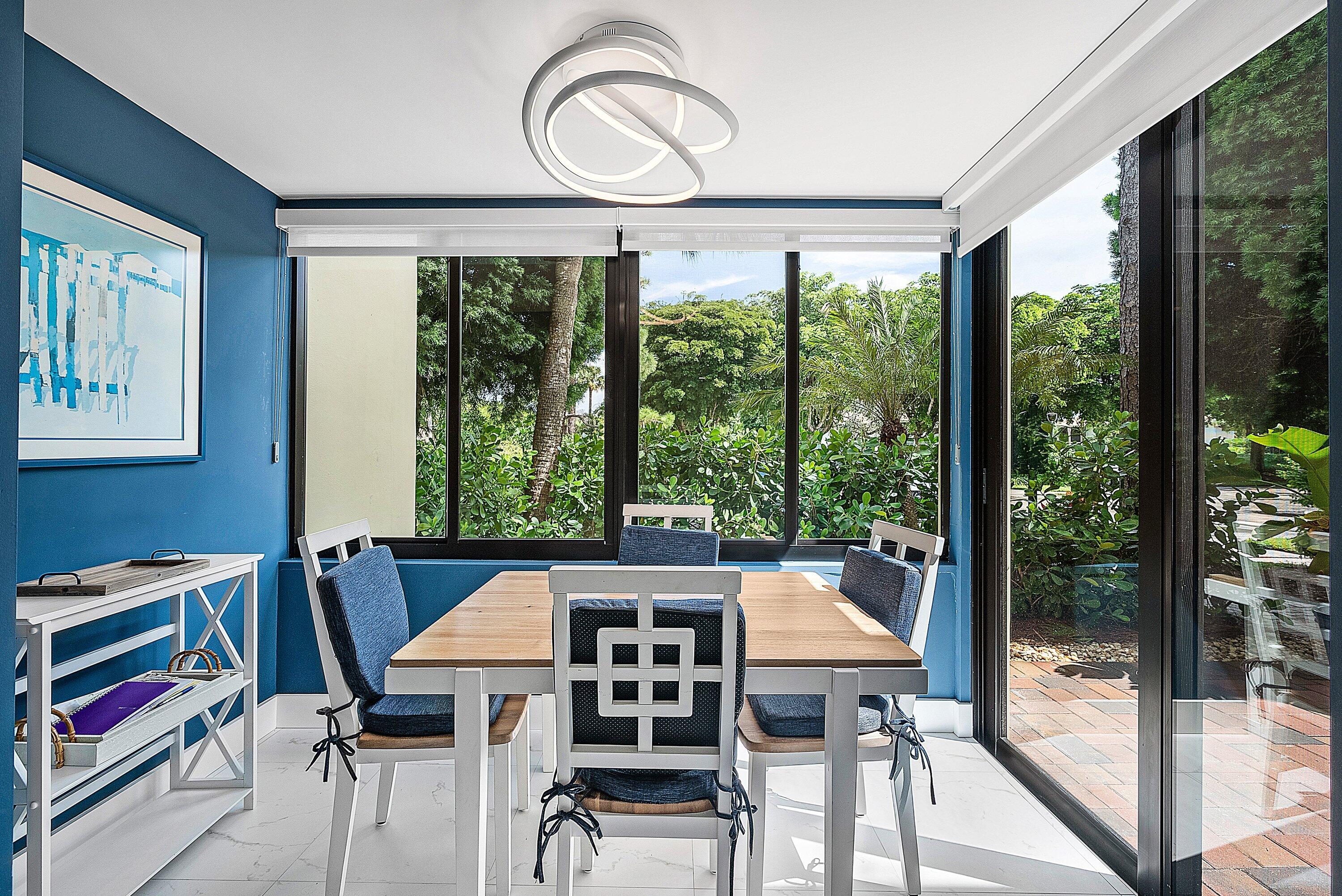 3709 North Quail Ridge Drive, Unit BOBWHITE B Boynton Beach, FL 33436 - Photo 14 of 51 a view of a dining room with furniture window and outside view