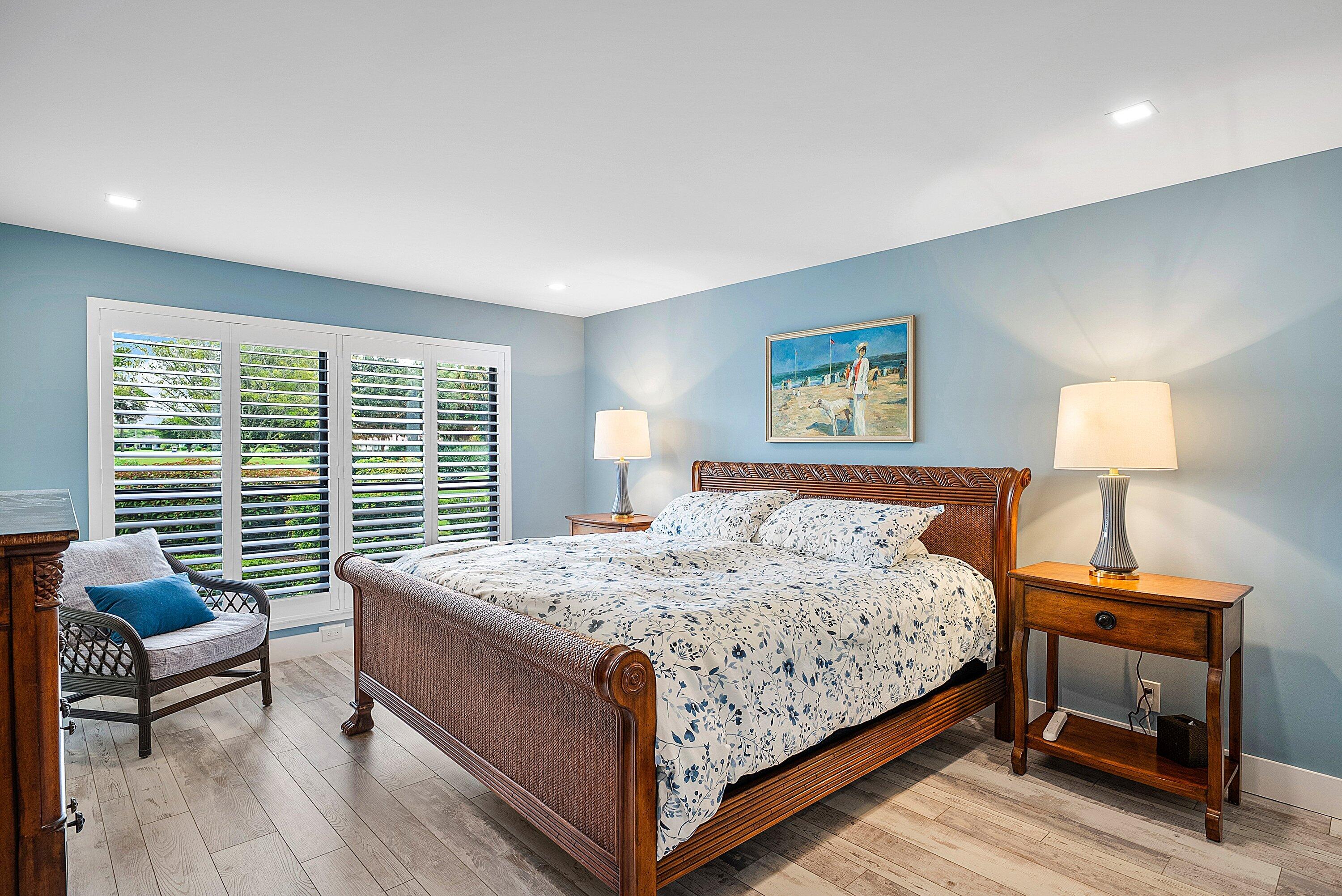 3709 North Quail Ridge Drive, Unit BOBWHITE B Boynton Beach, FL 33436 - Photo 16 of 51 a bedroom with a bed and a couch