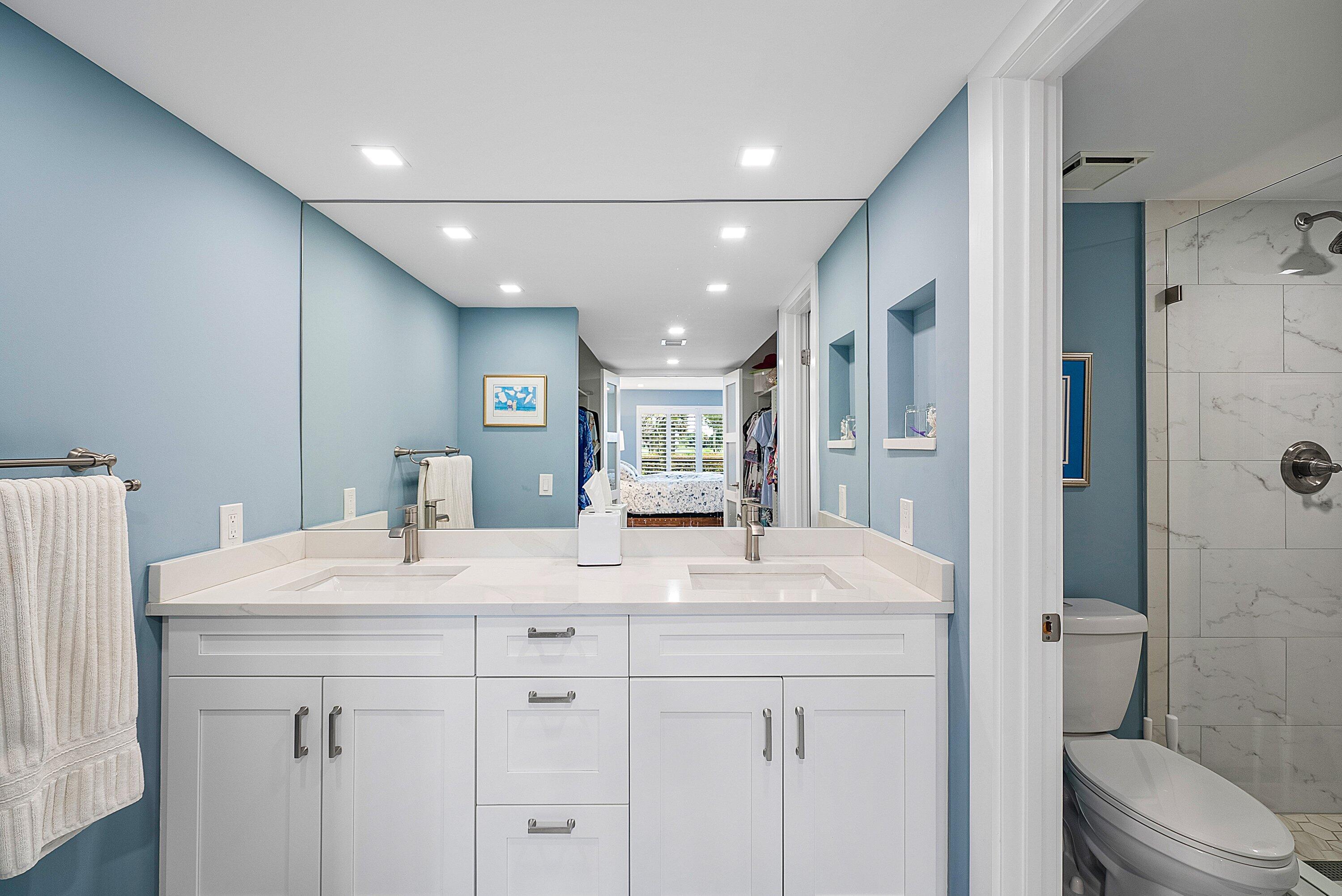 3709 North Quail Ridge Drive, Unit BOBWHITE B Boynton Beach, FL 33436 - Photo 19 of 51 a bathroom with a sink double vanity granite toilet and shower