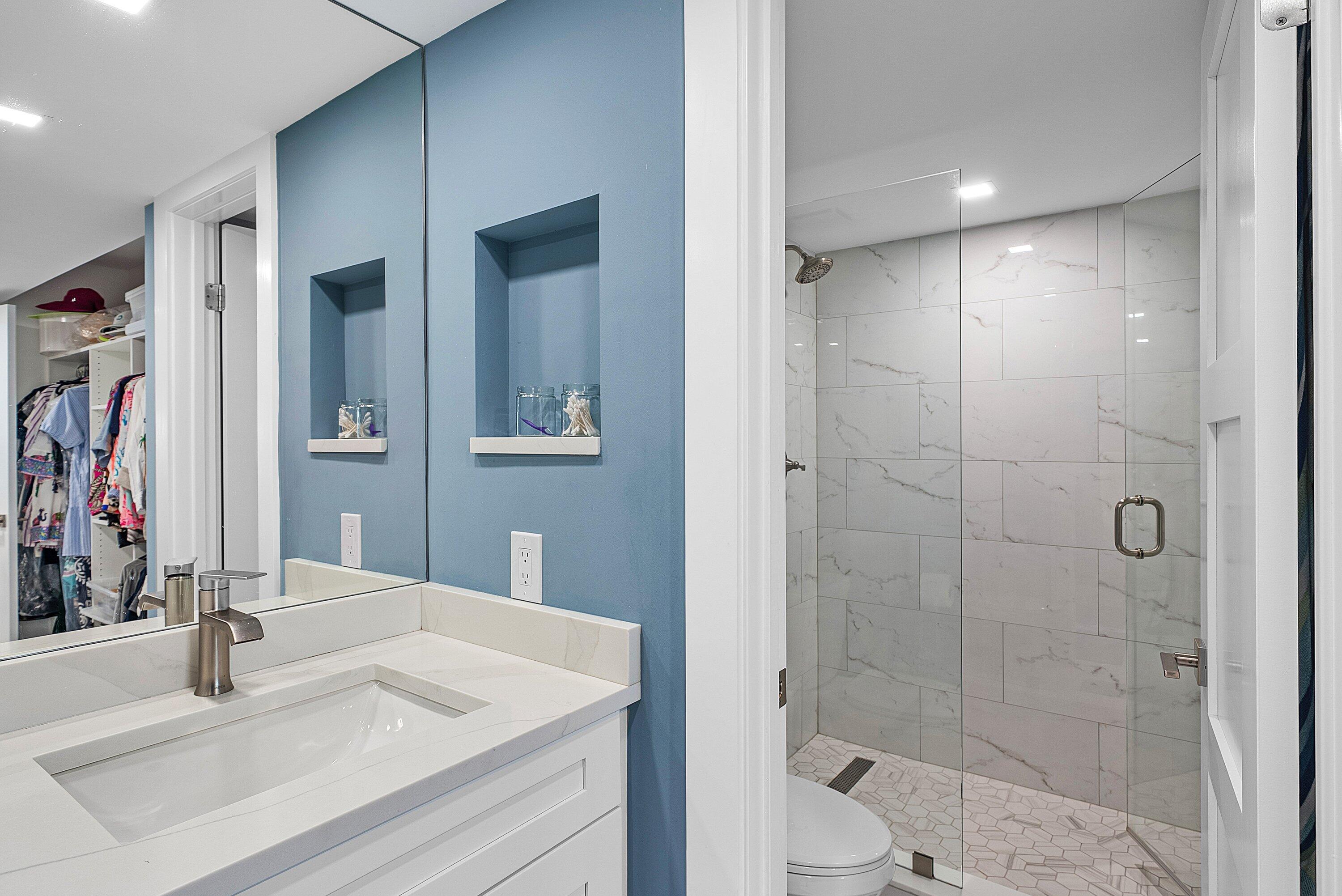 3709 North Quail Ridge Drive, Unit BOBWHITE B Boynton Beach, FL 33436 - Photo 20 of 51 a bathroom with a sink shower and a mirror