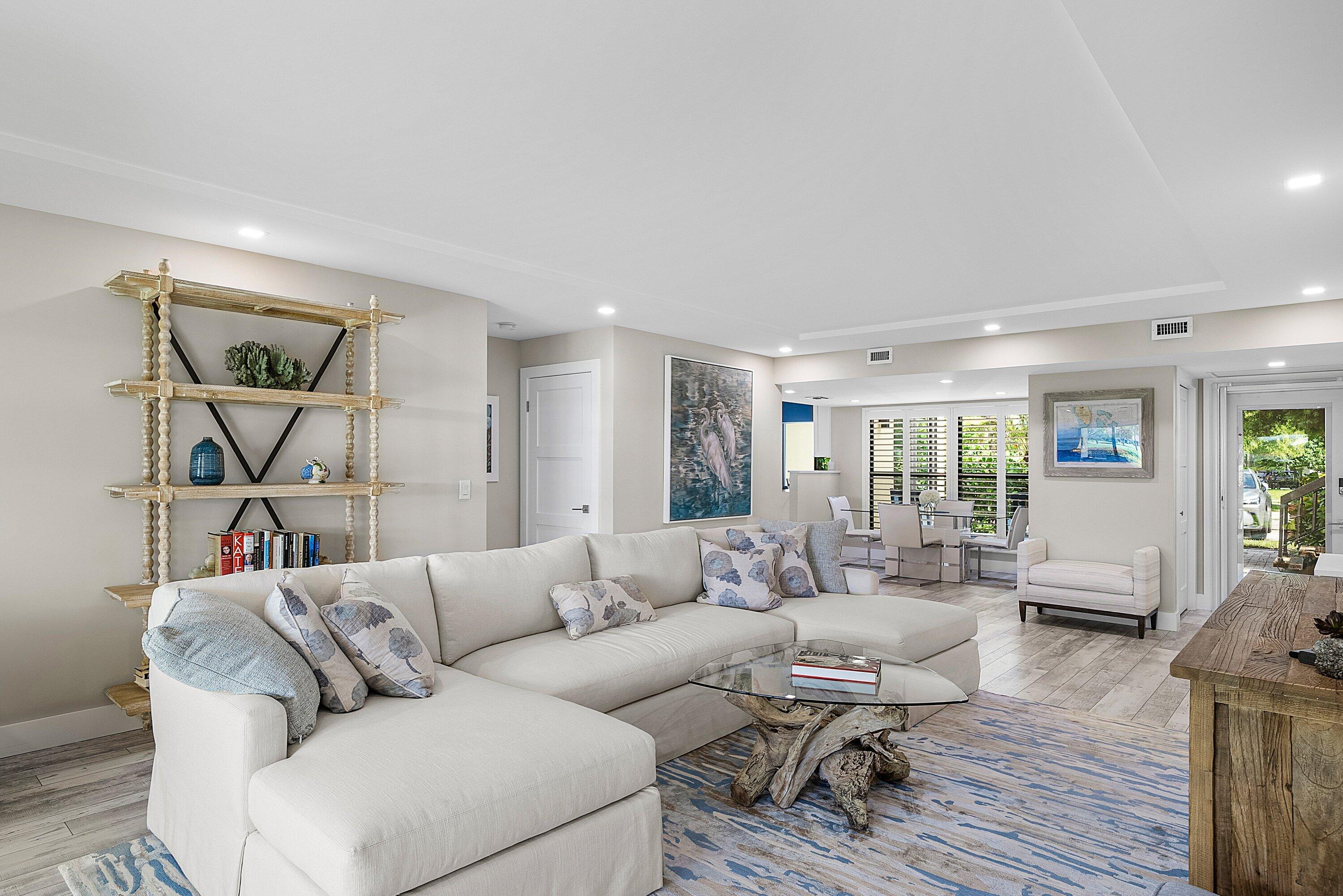 3709 North Quail Ridge Drive, Unit BOBWHITE B Boynton Beach, FL 33436 - Photo 2 of 51 a living room with furniture and a wooden floor