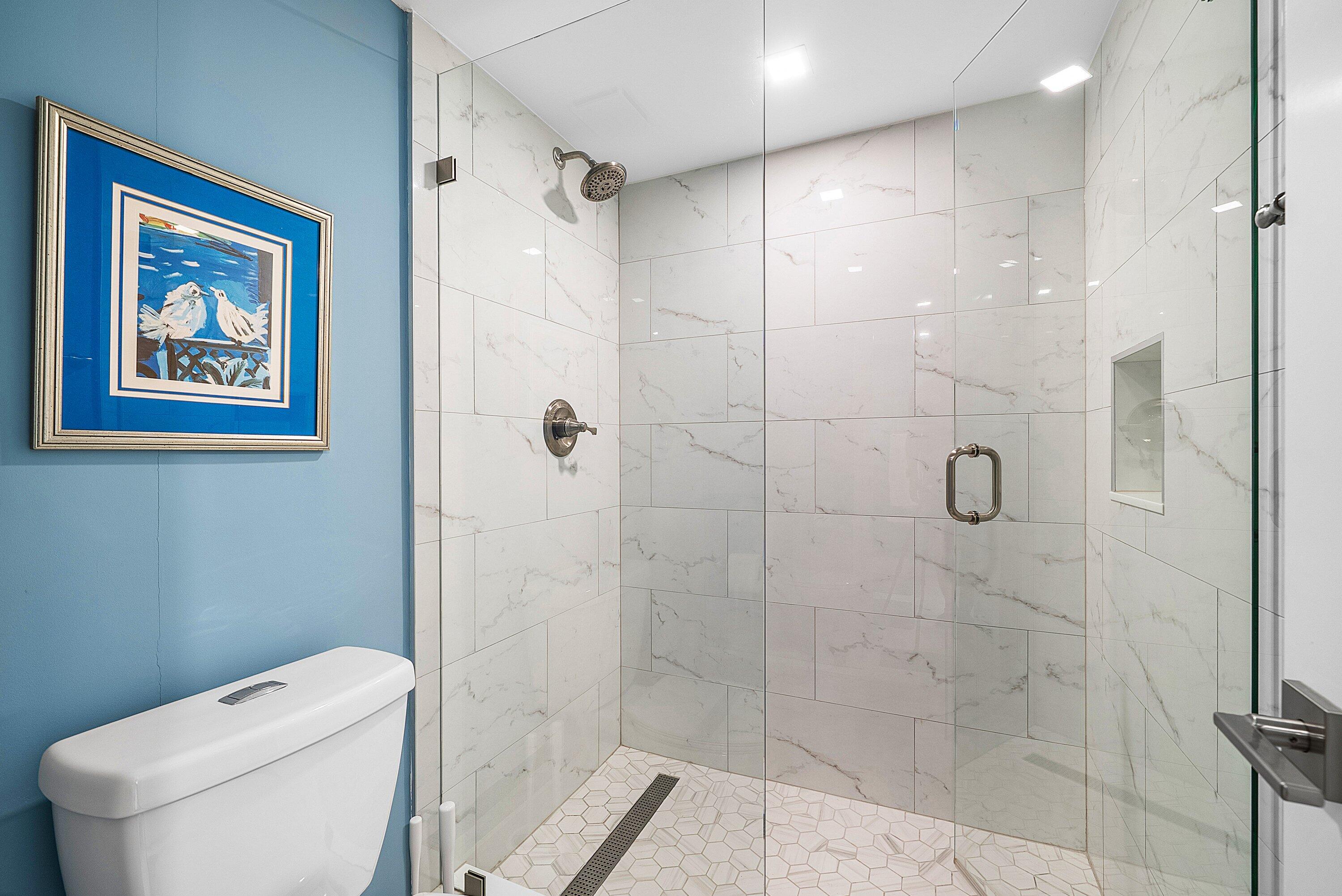 3709 North Quail Ridge Drive, Unit BOBWHITE B Boynton Beach, FL 33436 - Photo 21 of 51 a bathroom with a toilet and a shower