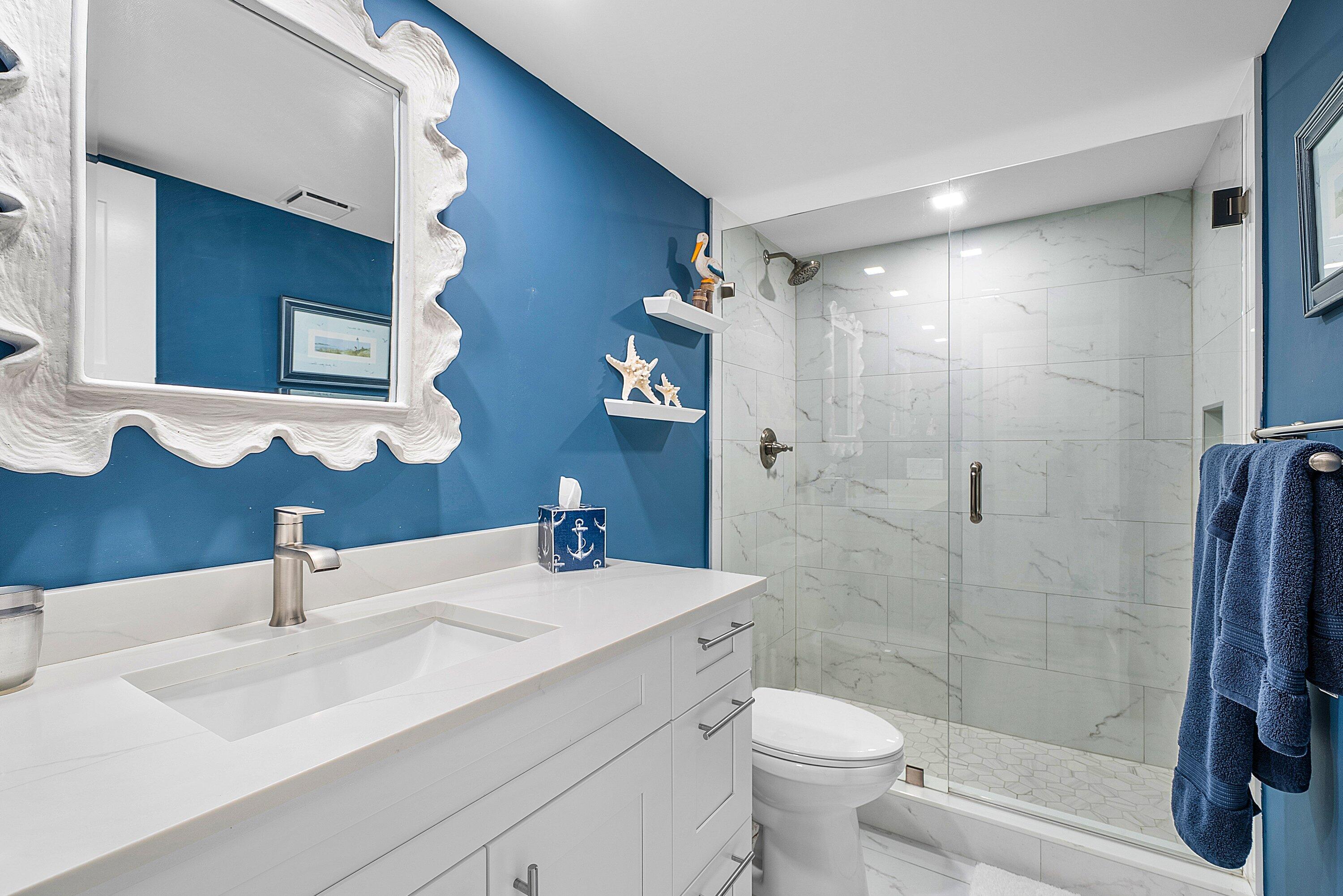 3709 North Quail Ridge Drive, Unit BOBWHITE B Boynton Beach, FL 33436 - Photo 23 of 51 a bathroom with a sink toilet and shower