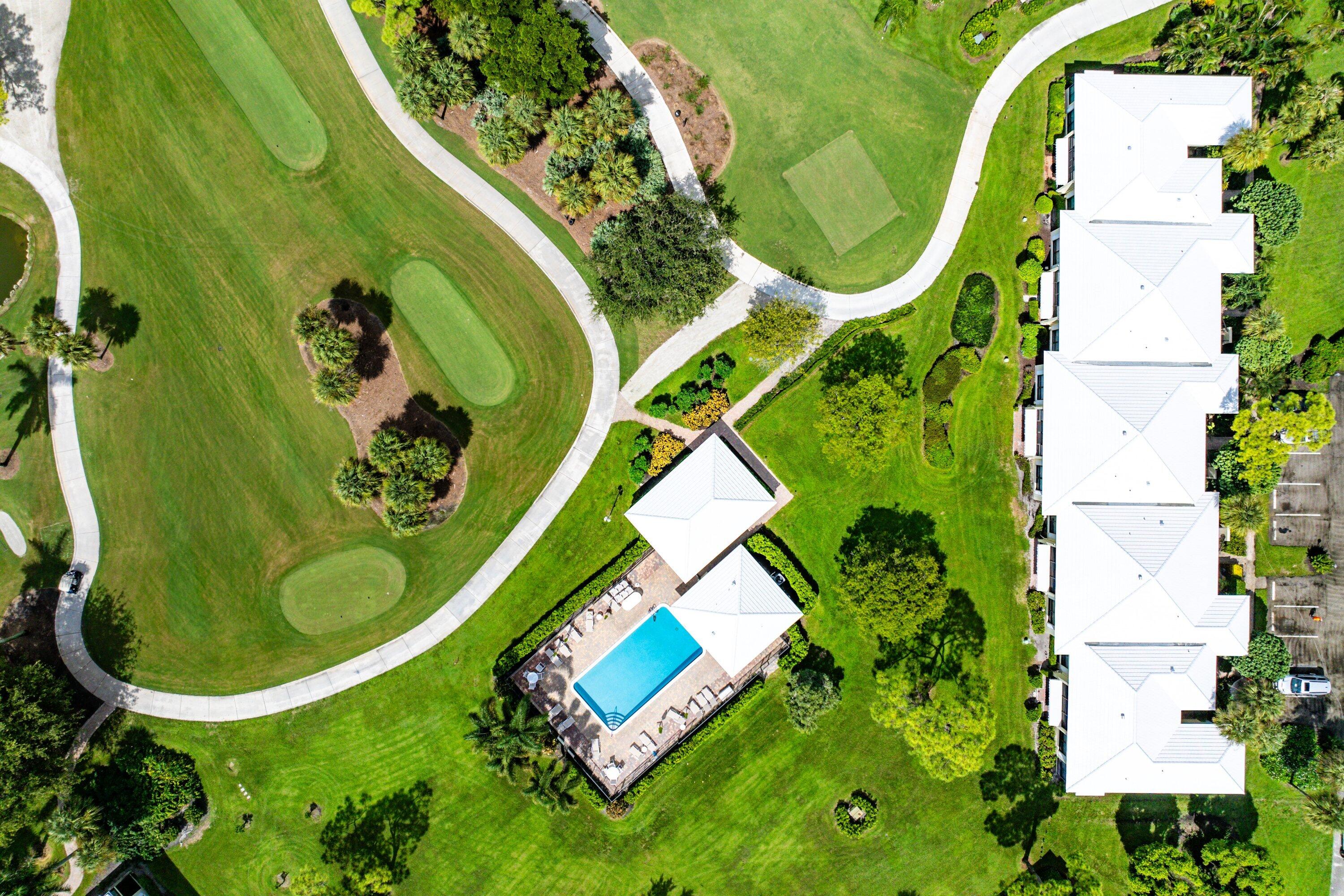 3709 North Quail Ridge Drive, Unit BOBWHITE B Boynton Beach, FL 33436 - Photo 32 of 51 an aerial view of a swimming pool