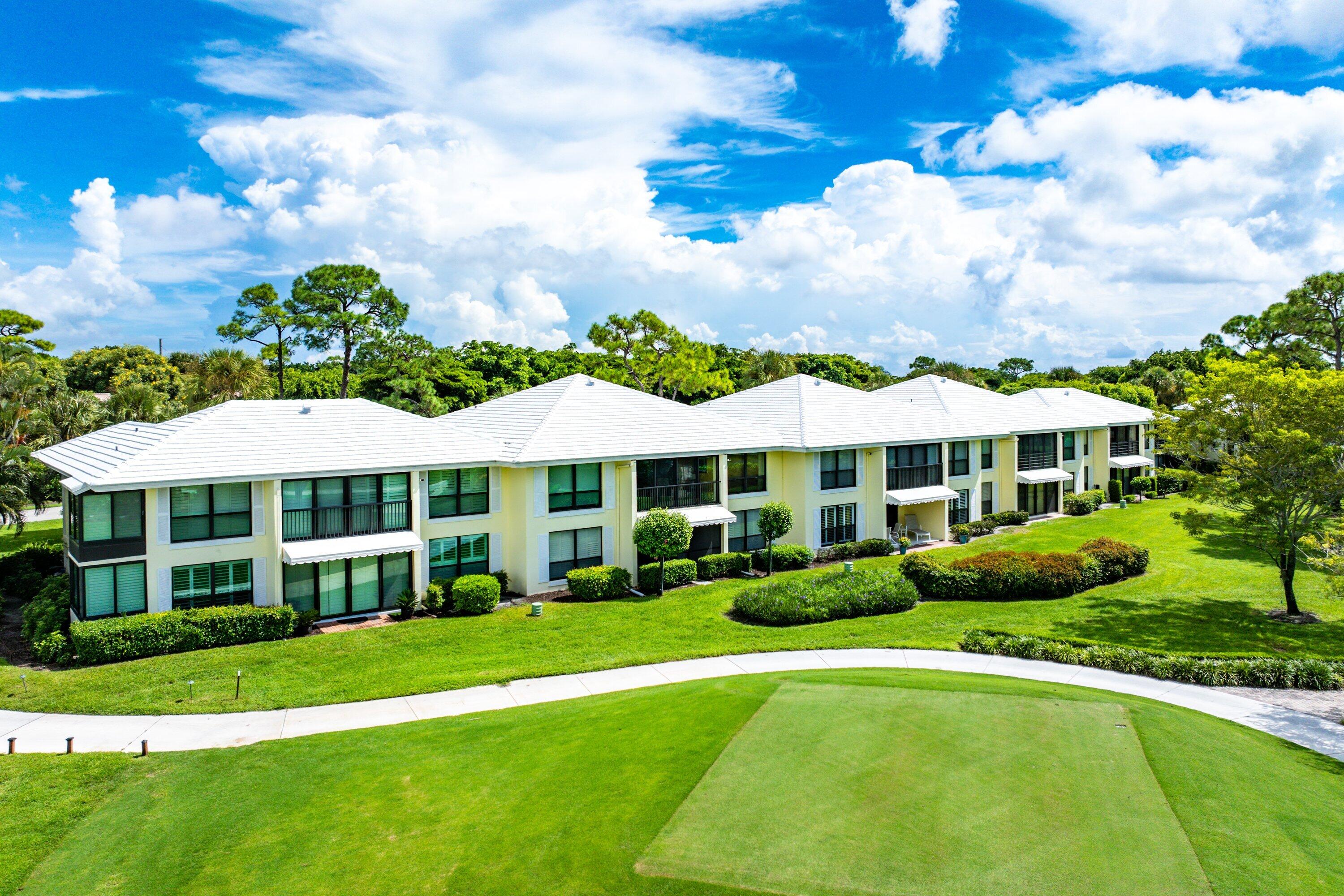 3709 North Quail Ridge Drive, Unit BOBWHITE B Boynton Beach, FL 33436 - Photo 33 of 51 a view of a house with a yard garden and sitting area
