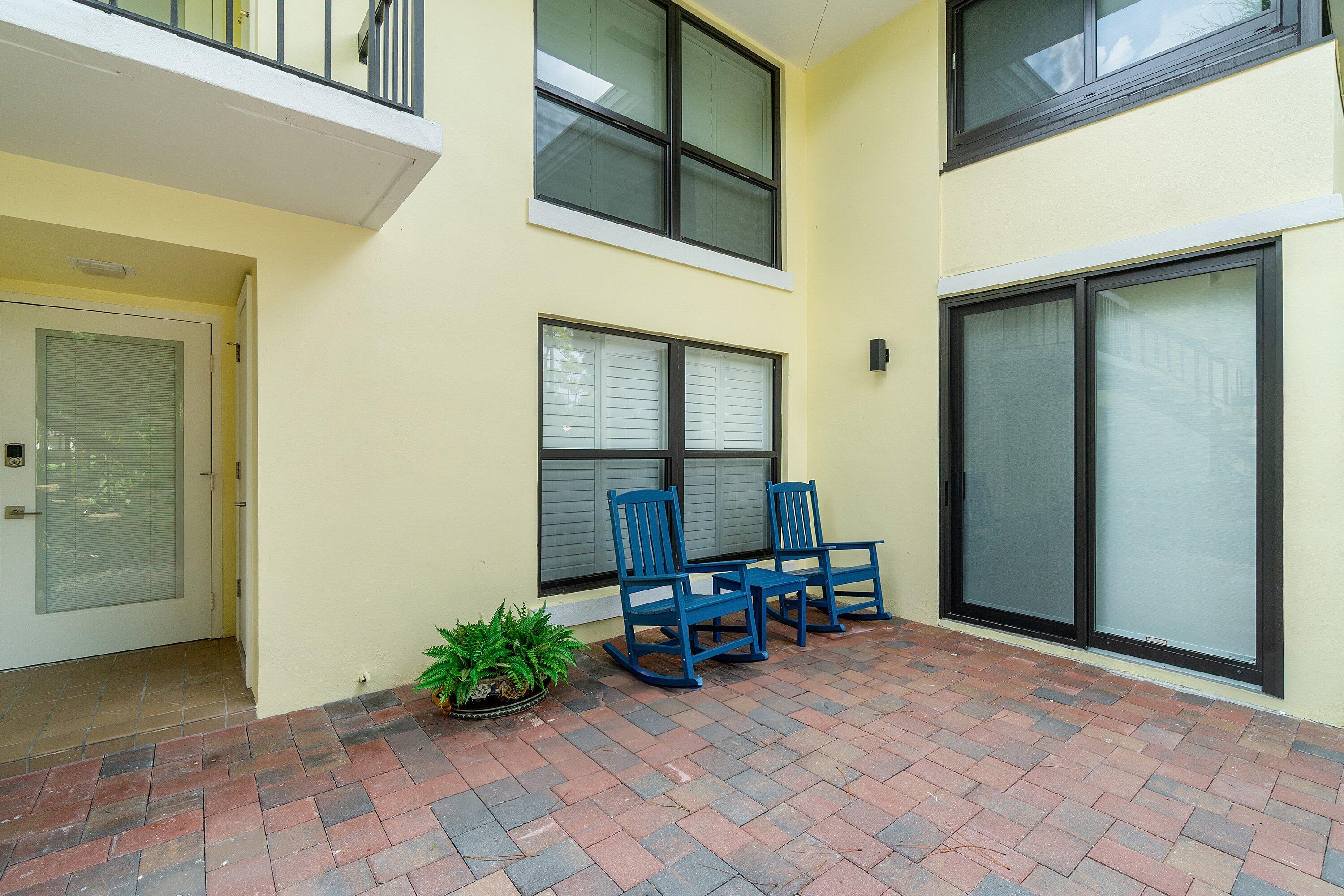 3709 North Quail Ridge Drive, Unit BOBWHITE B Boynton Beach, FL 33436 - Photo 41 of 51 a view of a chair and tables in the room