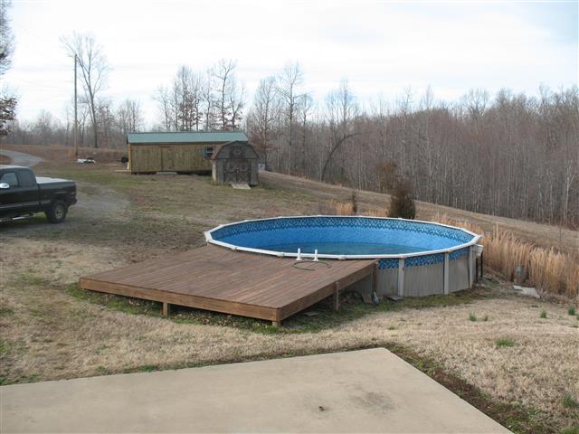 300 Edenway Road Dover, TN 37058 - Photo 2 of 20 Pool with deck, storage building in back ground.