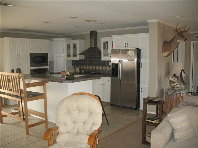 300 Edenway Road Dover, TN 37058 - Photo 8 of 20 Looking from Greatroom into kitchen with stainless steel appliances to convey.