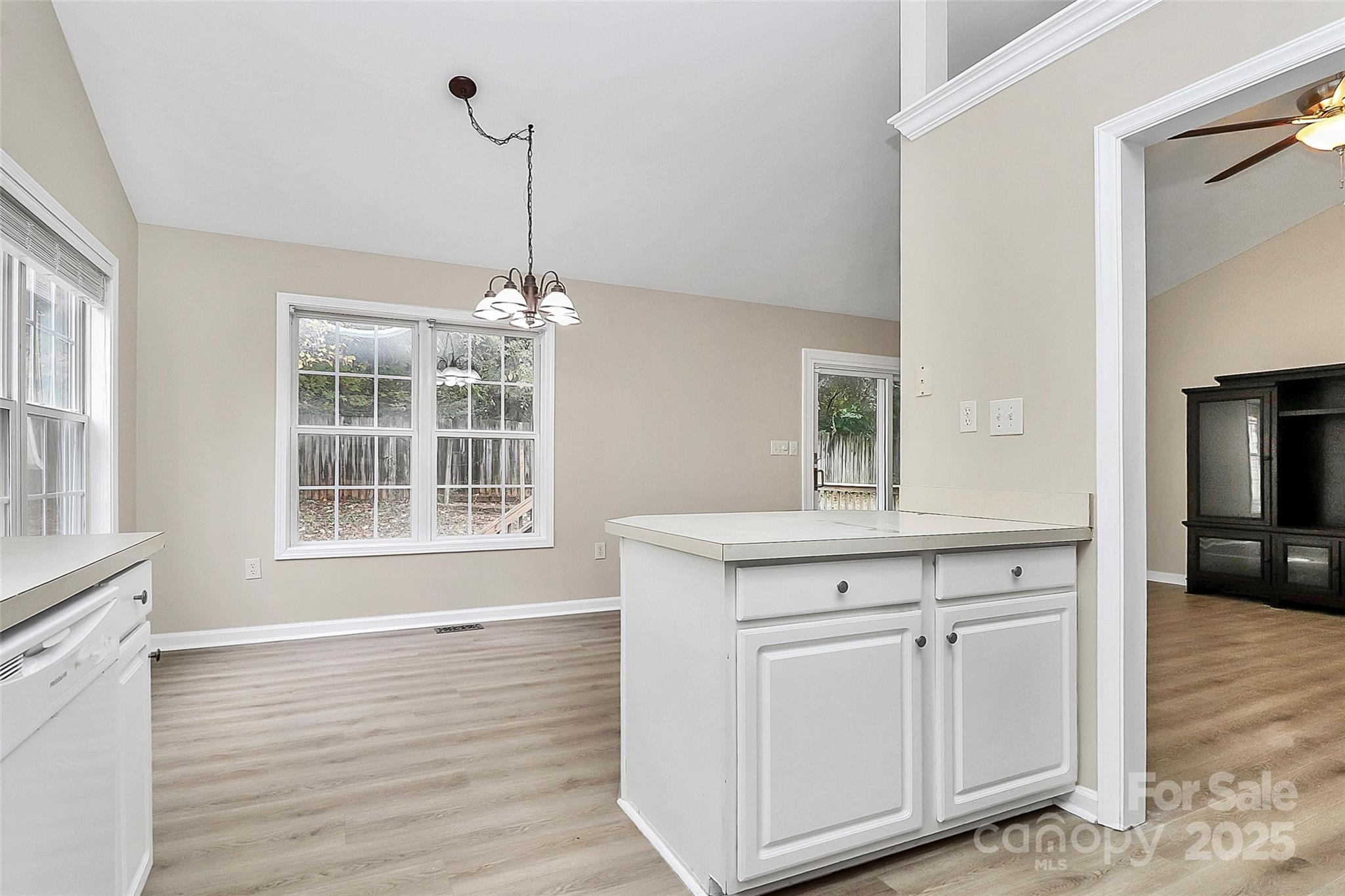 103 Wellspring Drive Fort Mill, SC 29715 - Photo 14 of 36 a kitchen with stainless steel appliances granite countertop a sink window and cabinets