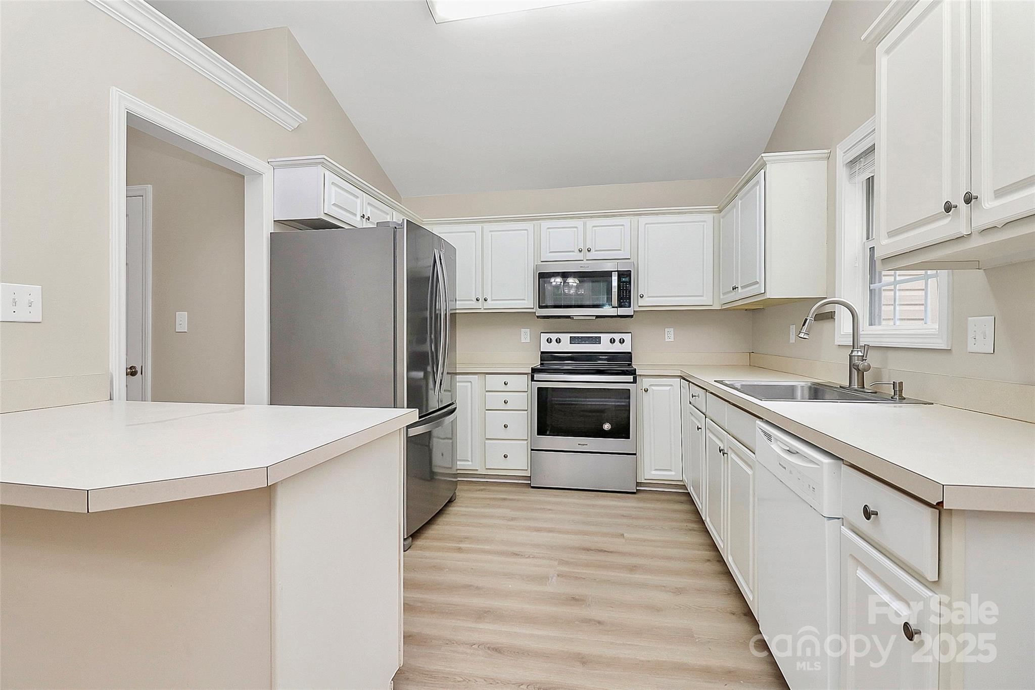 103 Wellspring Drive Fort Mill, SC 29715 - Photo 16 of 36 a kitchen with a sink a stove top oven and refrigerator