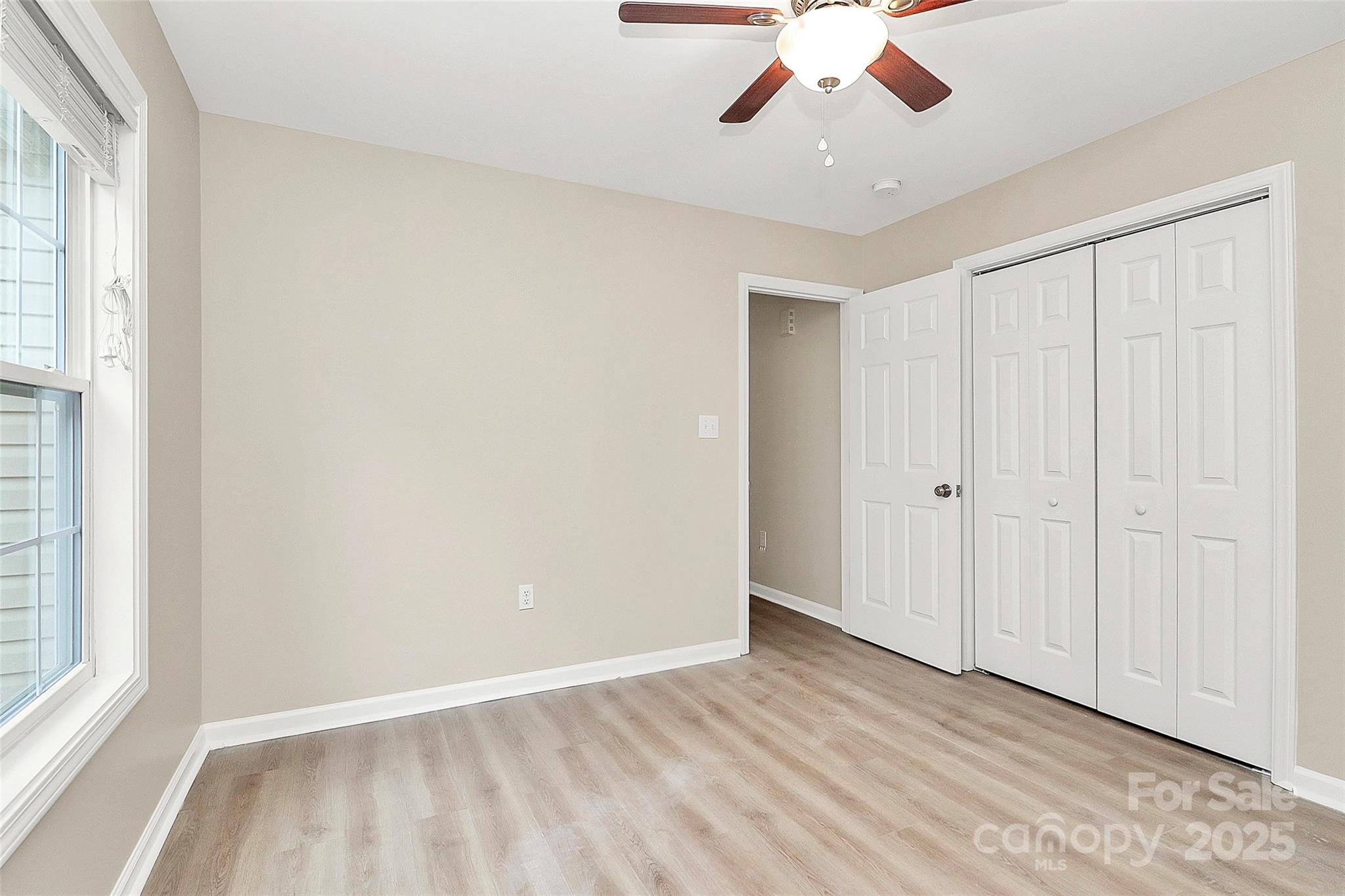 103 Wellspring Drive Fort Mill, SC 29715 - Photo 30 of 36 wooden floor in an empty room with a window