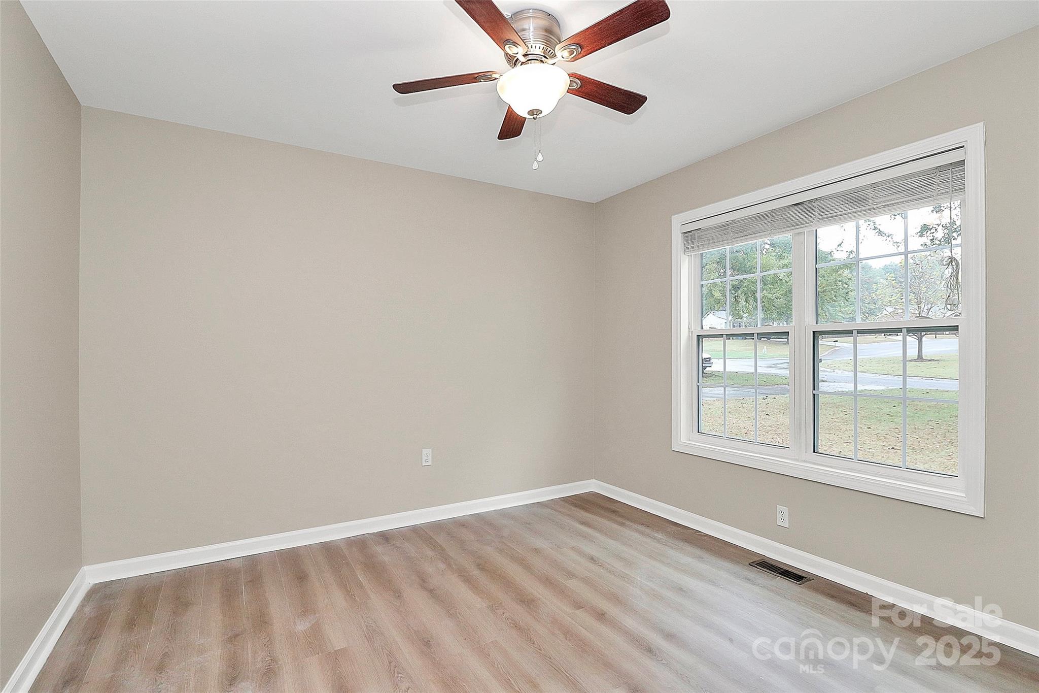103 Wellspring Drive Fort Mill, SC 29715 - Photo 32 of 36 wooden floor in an empty room with a window