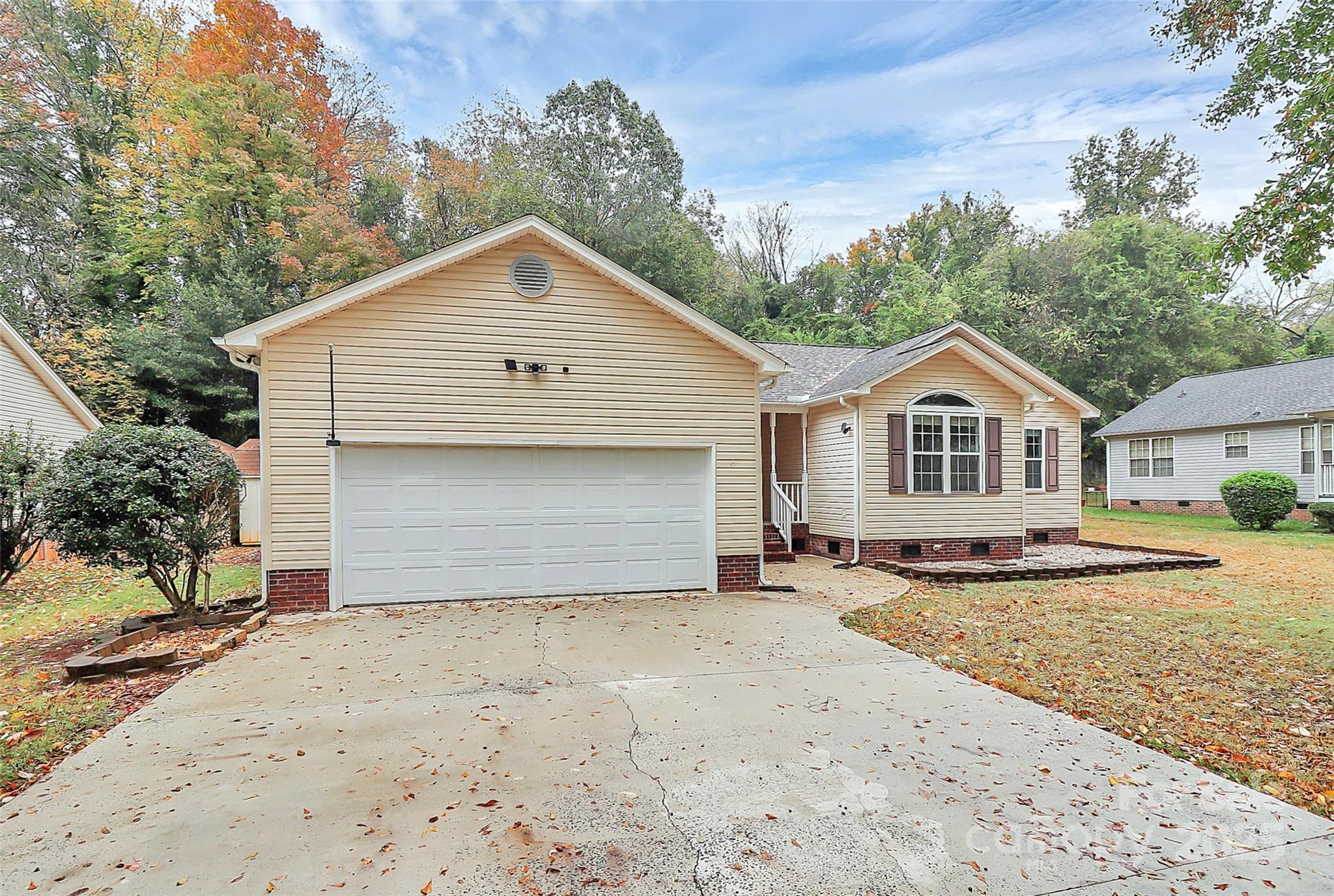 103 Wellspring Drive Fort Mill, SC 29715 - Photo 4 of 36 a front view of a house with a yard and garage