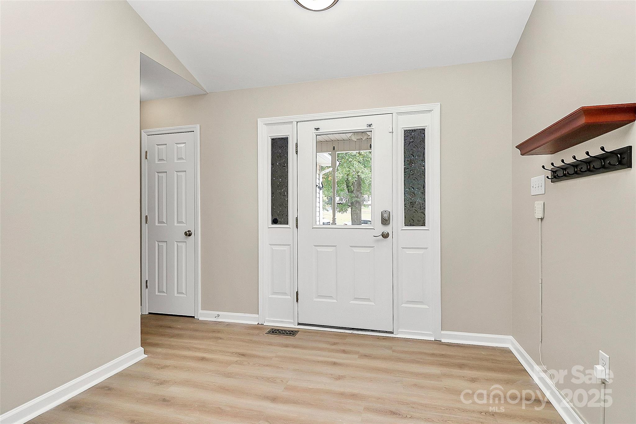 103 Wellspring Drive Fort Mill, SC 29715 - Photo 5 of 36 a view of an empty room with wooden floor and a window