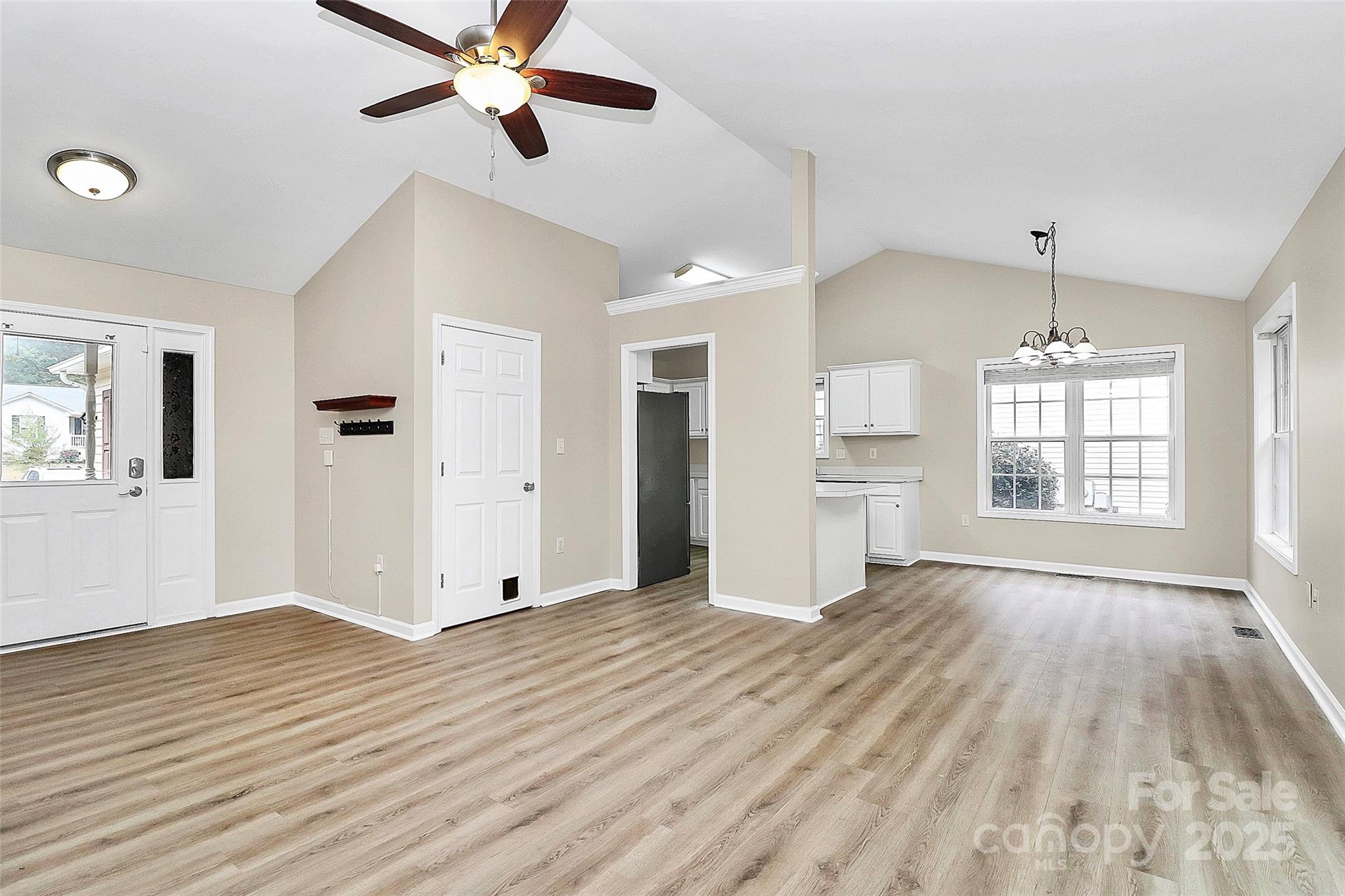 103 Wellspring Drive Fort Mill, SC 29715 - Photo 6 of 36 a view of an empty room with window and wooden floor