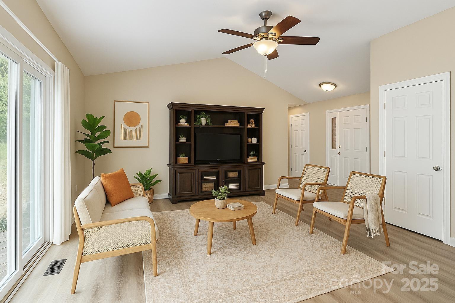103 Wellspring Drive Fort Mill, SC 29715 - Photo 7 of 36 a living room with furniture a ceiling fan and a rug