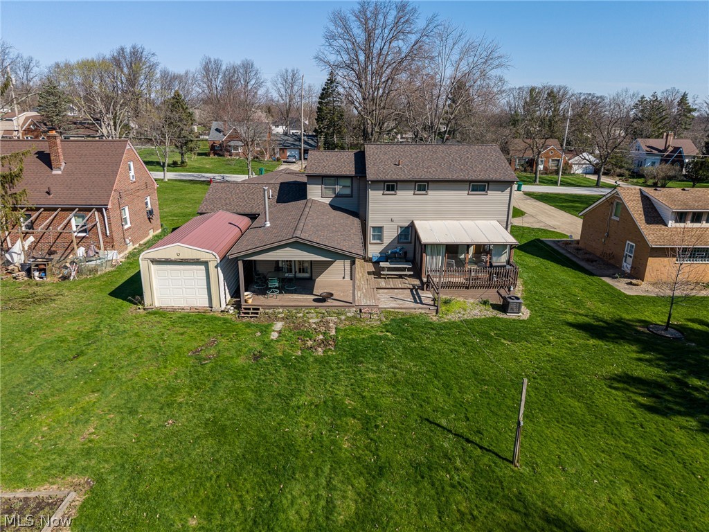 490 Mapleview Drive Seven Hills, OH 44131 - Photo 45 of 50 Back of property with a residential view, a deck, and a lawn