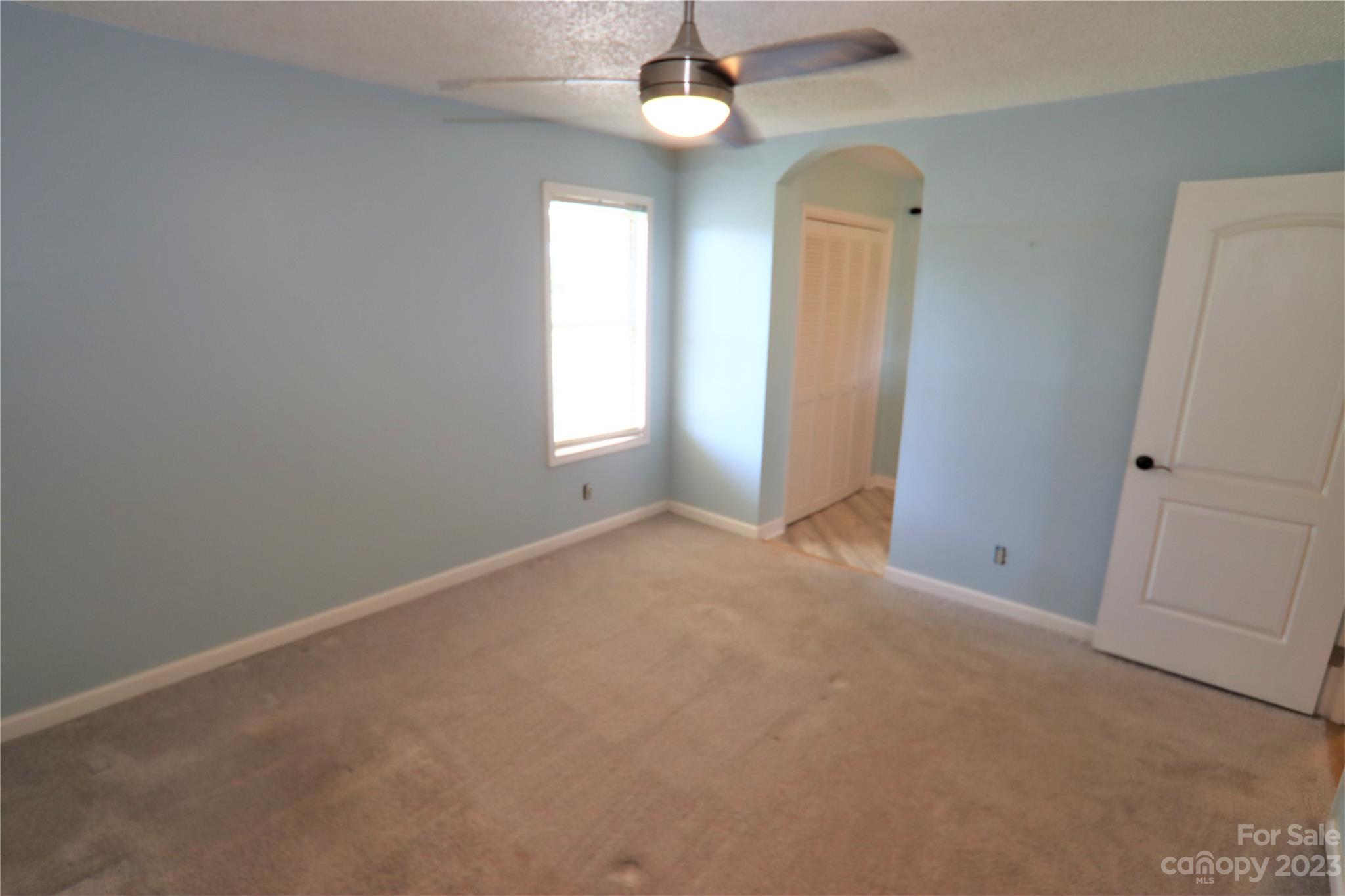 12725 Mooresville Road Mount Ulla, NC 28125 - Photo 16 of 23 an empty room with windows and closet
