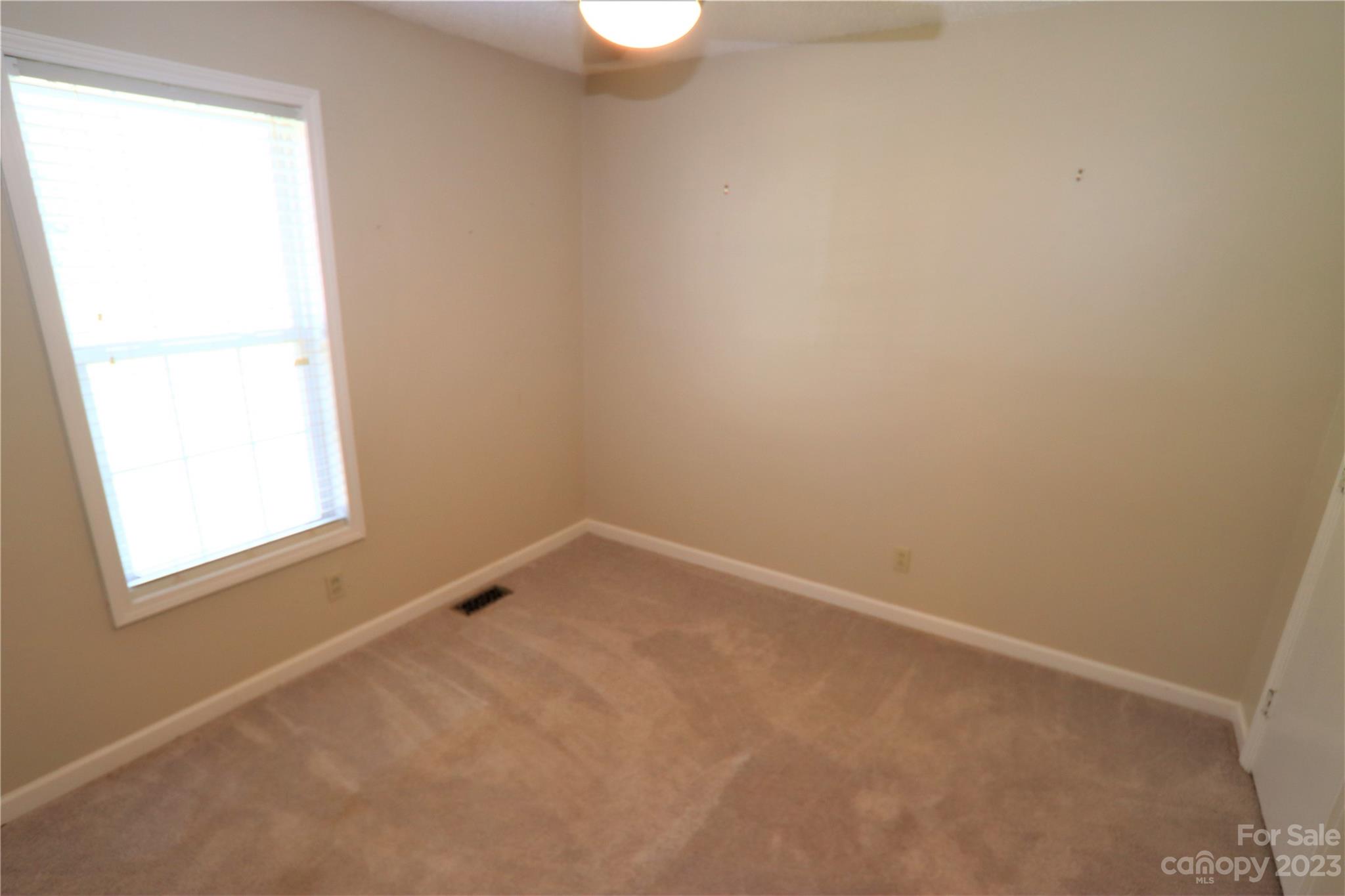 12725 Mooresville Road Mount Ulla, NC 28125 - Photo 17 of 23 an empty room with a window