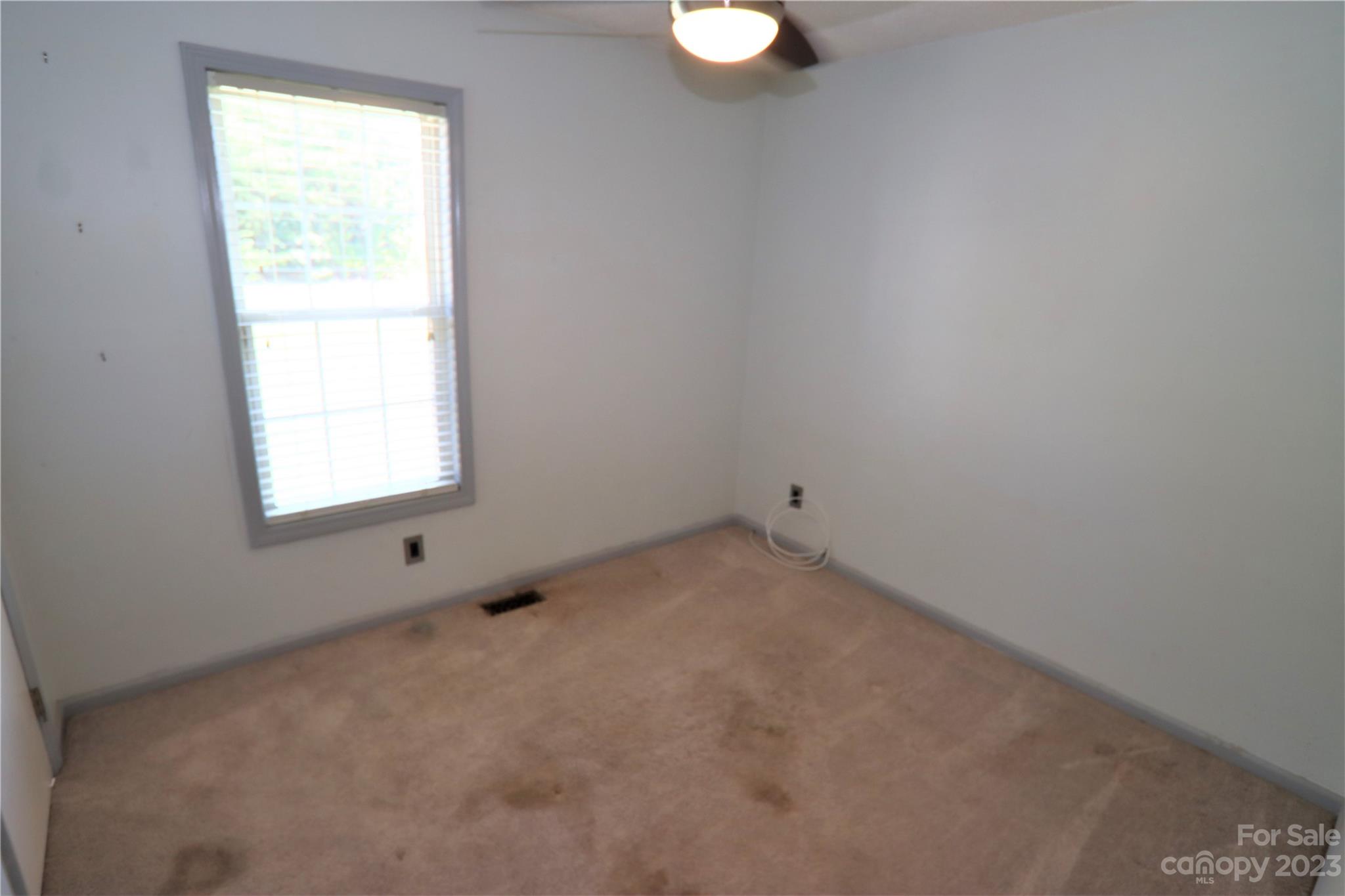 12725 Mooresville Road Mount Ulla, NC 28125 - Photo 18 of 23 an empty room with a window