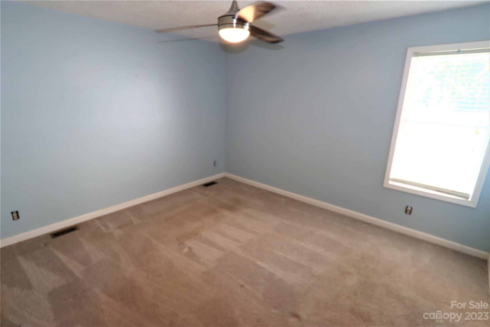 12725 Mooresville Road Mount Ulla, NC 28125 - Photo 6 of 23 an empty room with a window