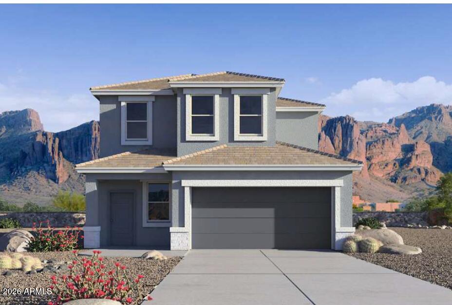a front view of a house with a garage