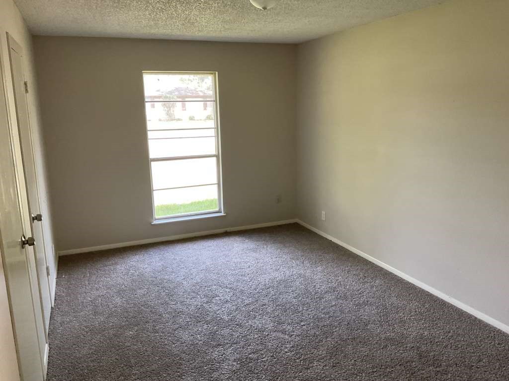 1501 Azalea Street Sweeny, TX 77480 - Photo 7 of 12 an empty room with a window