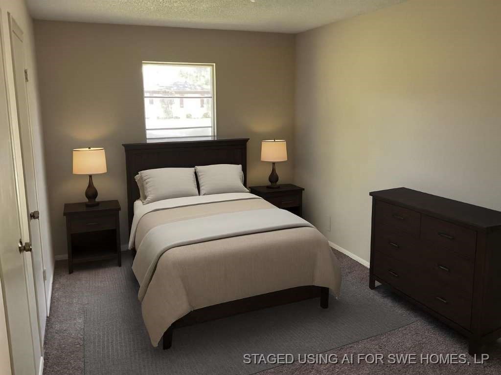 1501 Azalea Street Sweeny, TX 77480 - Photo 8 of 12 a bedroom with a bed and a lamp on dresser